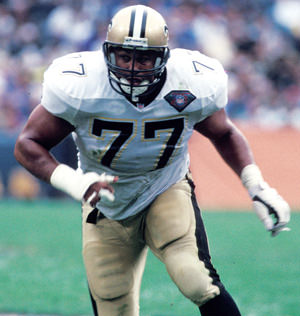 Image of WIllie Roaf playing football